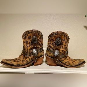 Handmade in Mexico leopard leather ankle boots with metal western buckle detail.